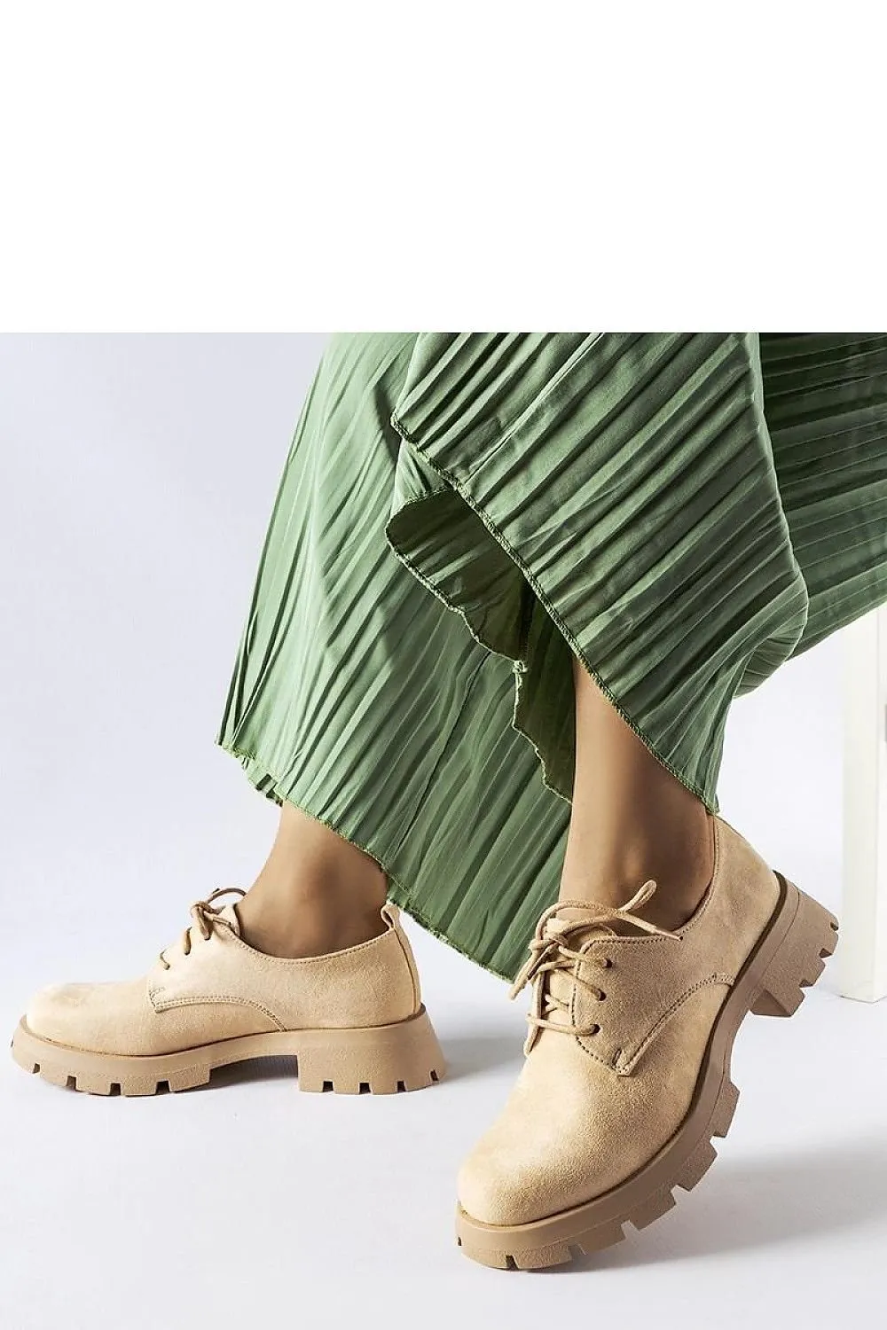 Beige half boots on a solid Coleman sole