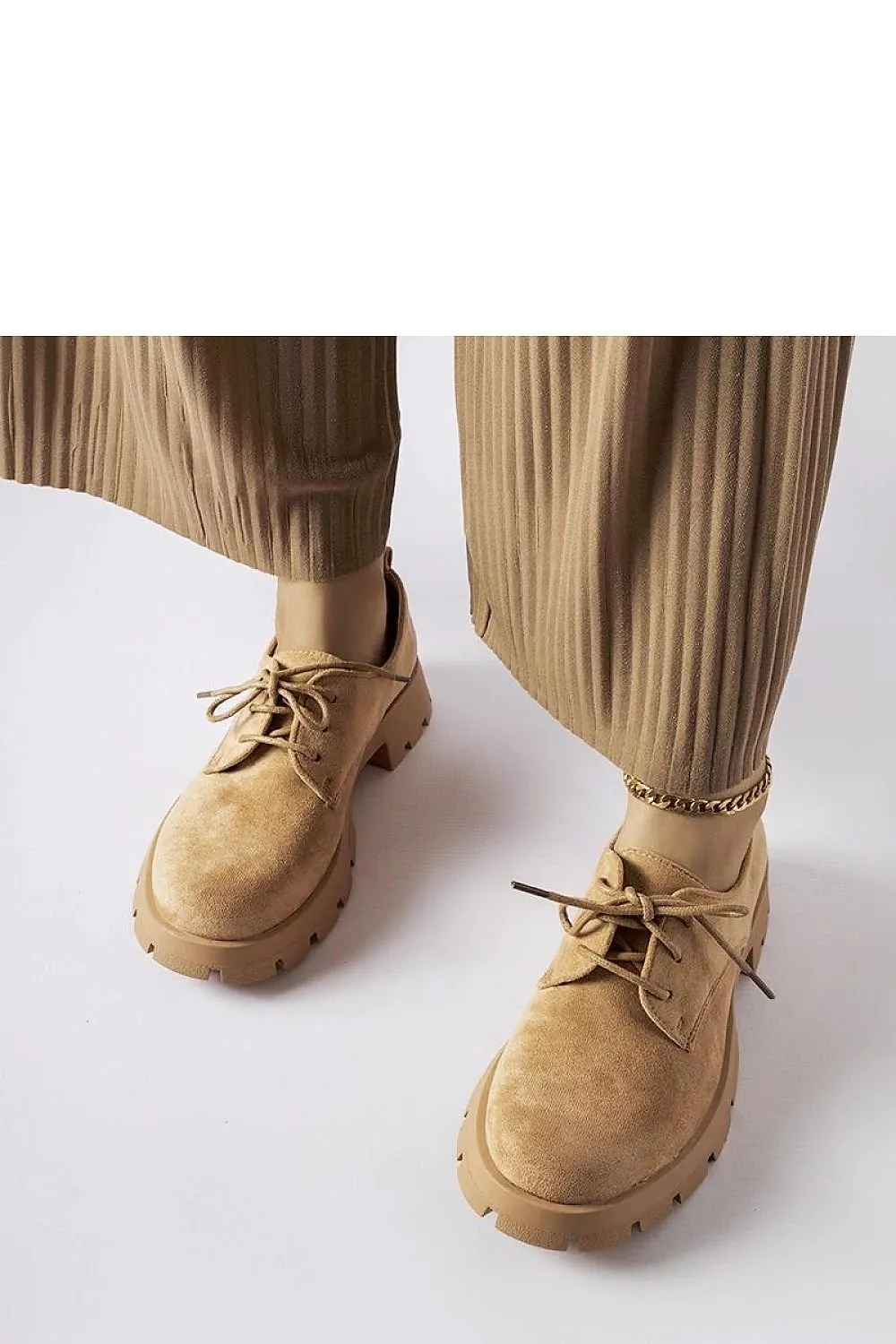 Beige half boots on a solid Coleman sole