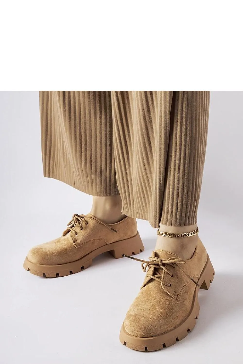 Beige half boots on a solid Coleman sole