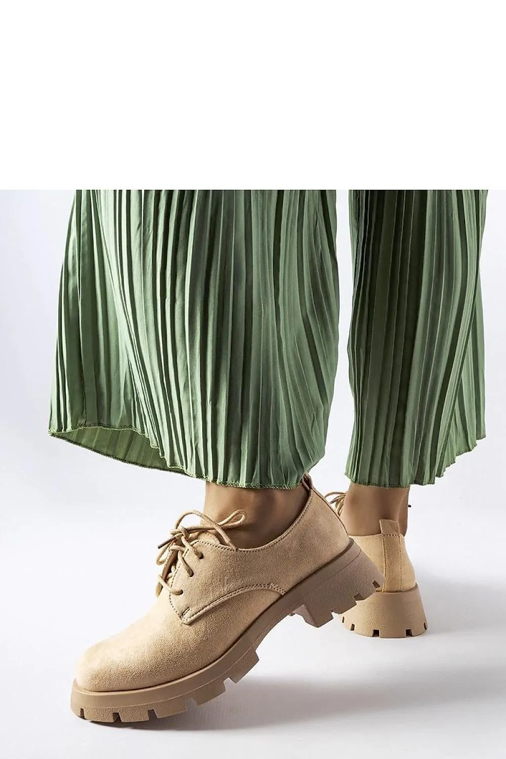 Beige half boots on a solid Coleman sole