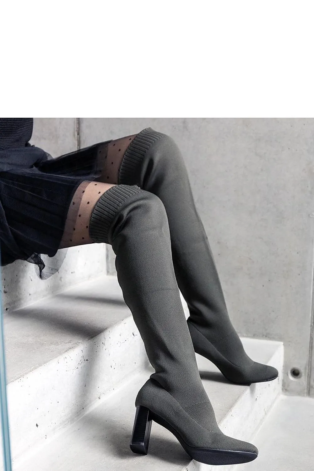Green slip-on heel boots with elastic upper