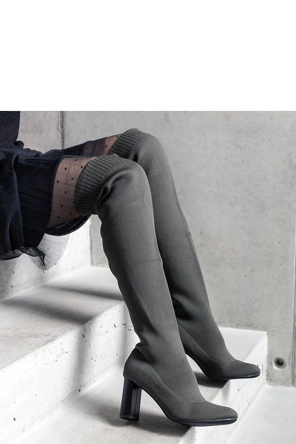 Green slip-on heel boots with elastic upper